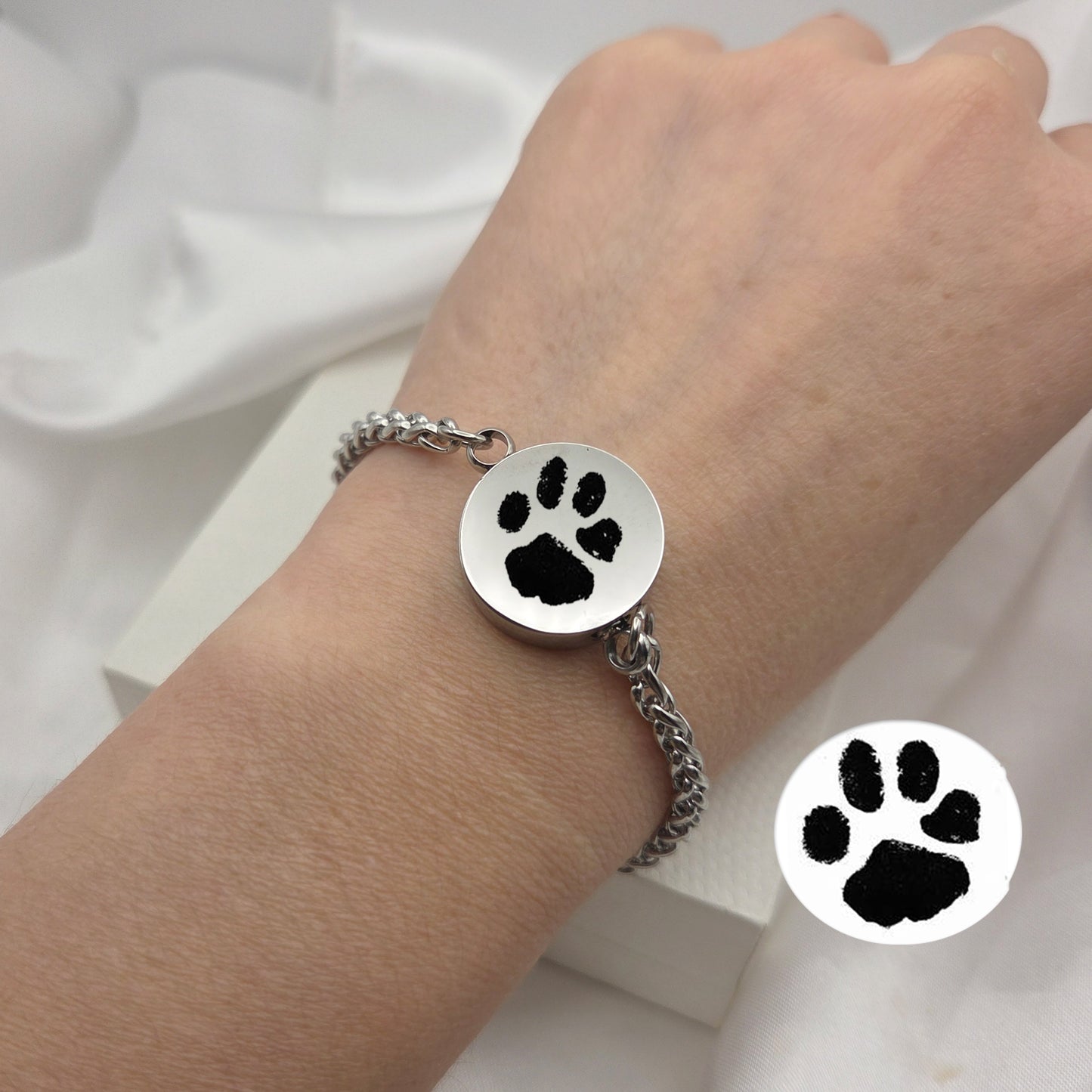 Custom paw print round urn bracelet for ashes.