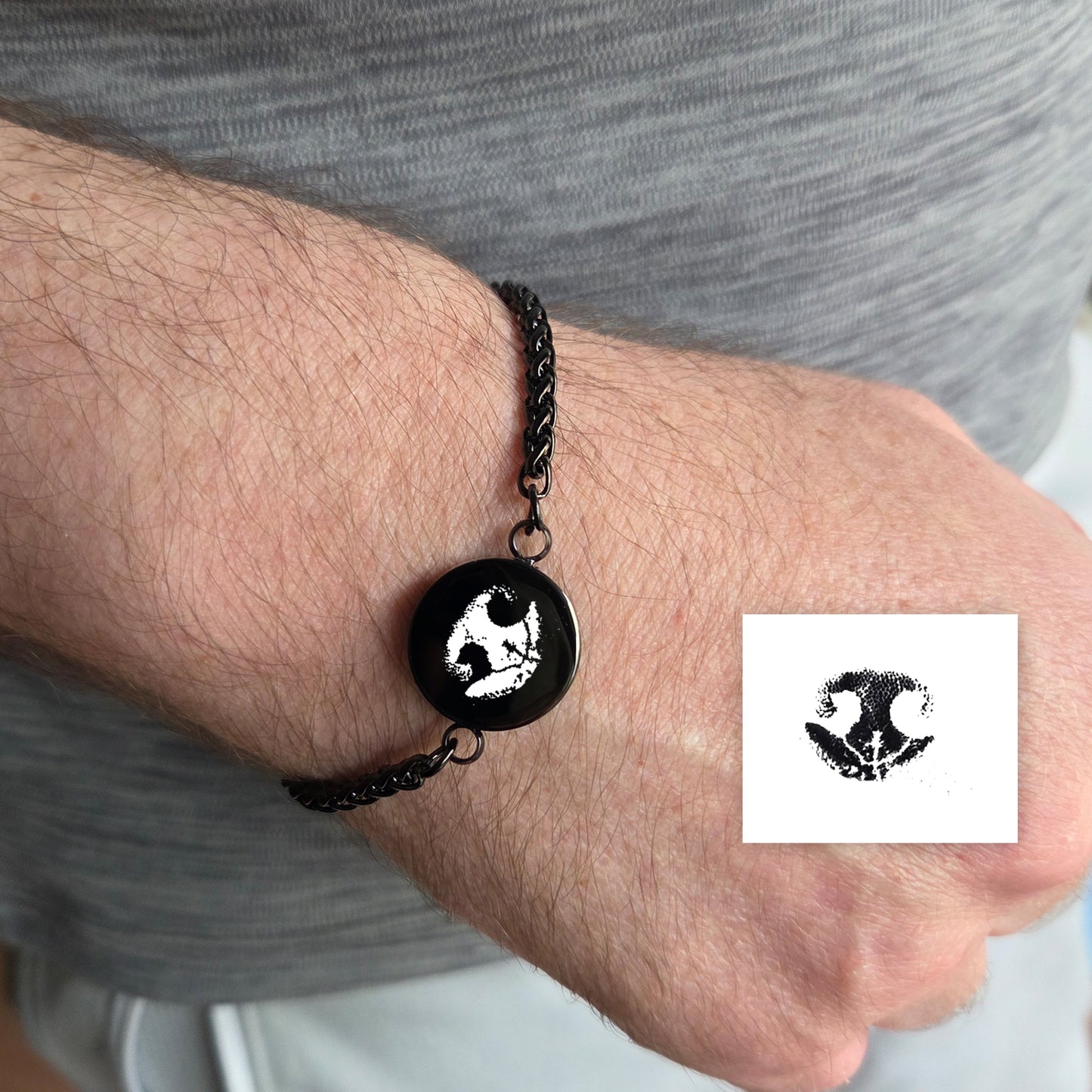 Custom paw print round urn bracelet for ashes.