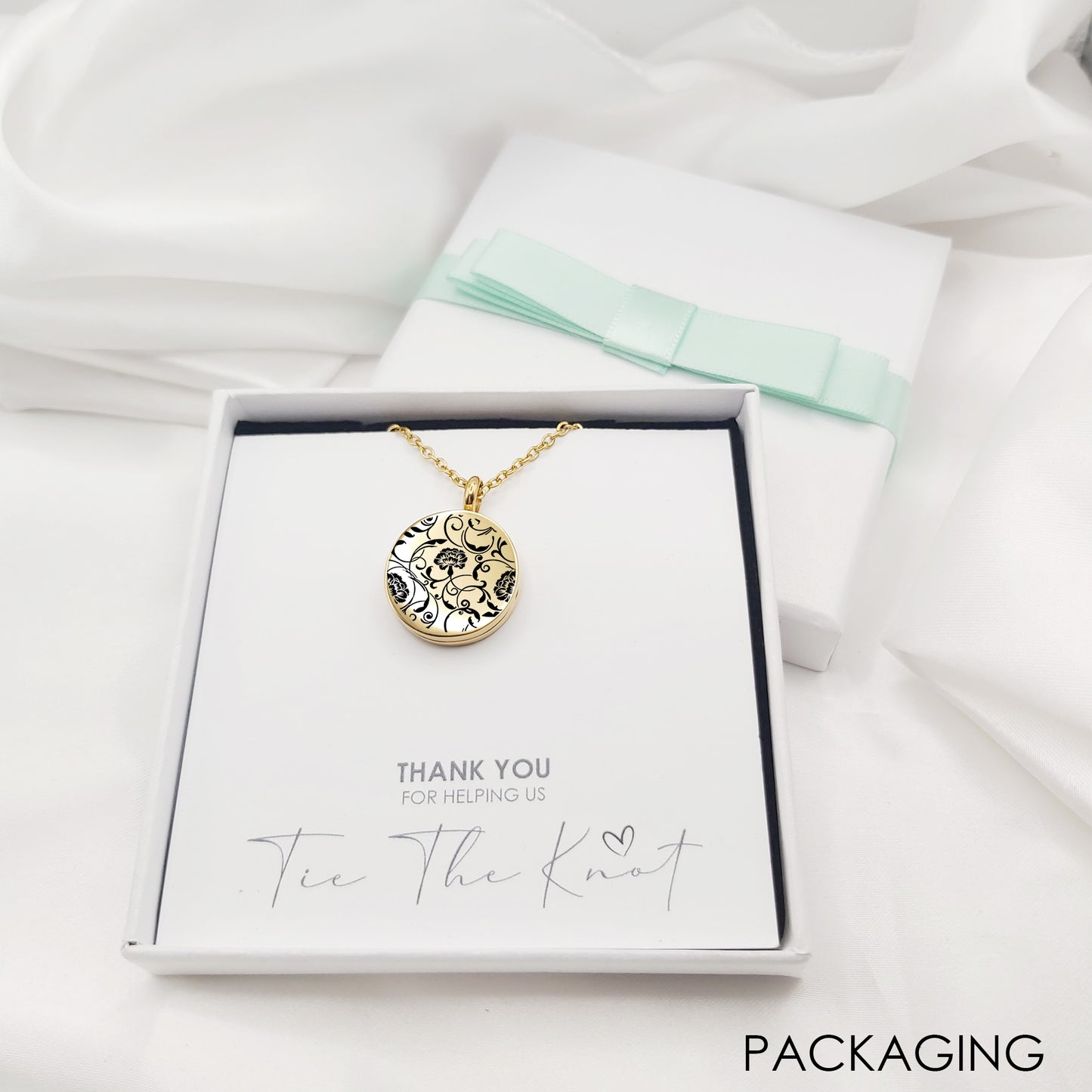Personalized wedding locket with birth flower for bridesmaids.