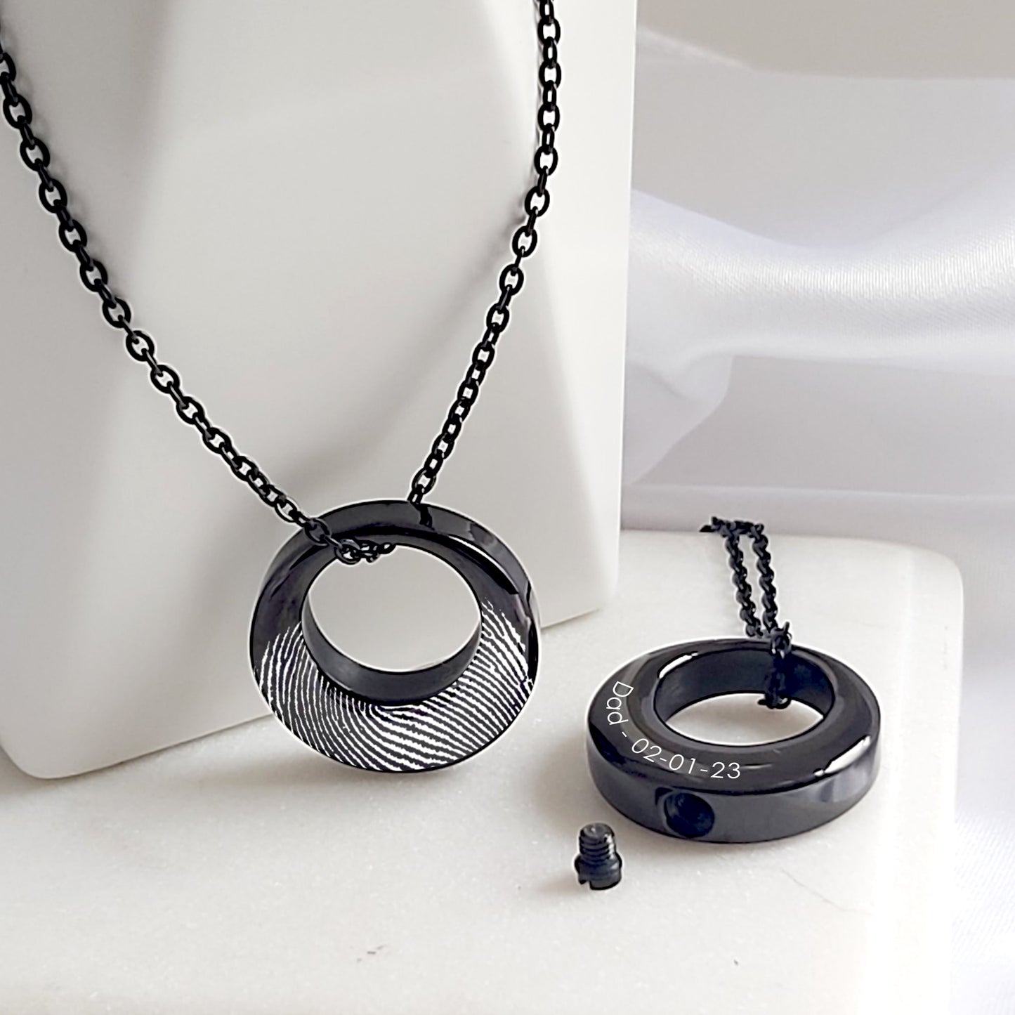 Custom thumbprint Infinity urn necklace for human ashes.