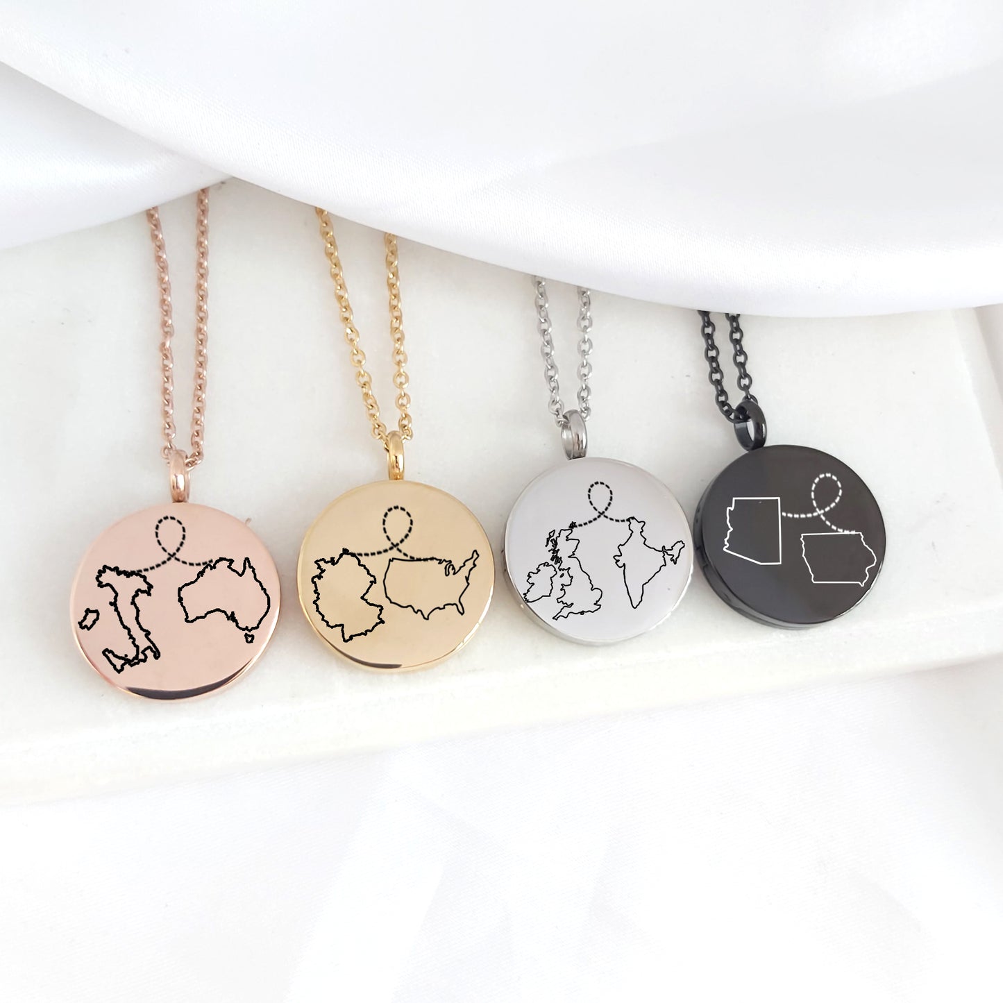 Two country map locket with photos.