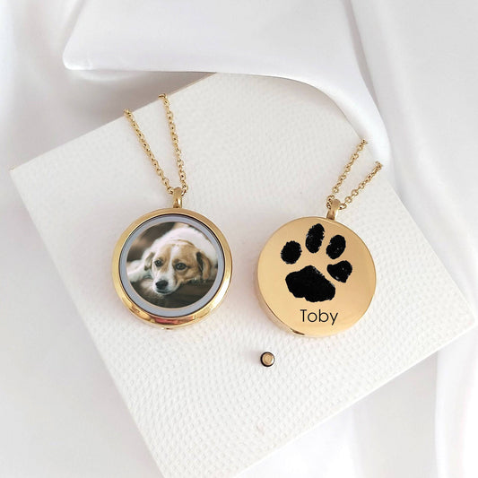 Pet paw print memorial locket with photos and urn for ashes. - mobimomentos