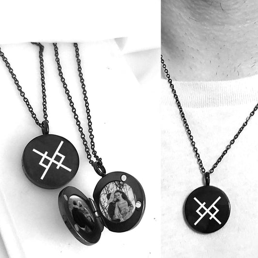 Black locket necklace engraved with love viking symbol, shown on a person wearing it.