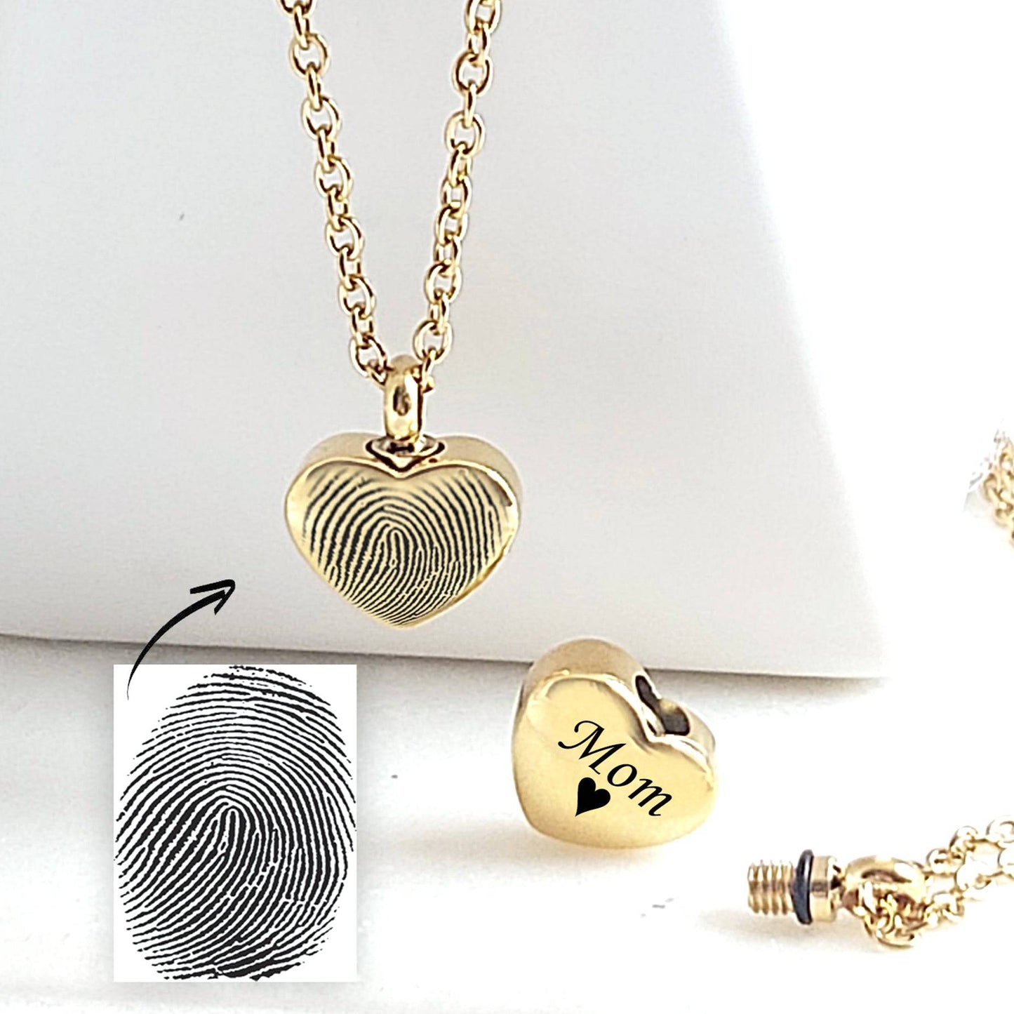 Personalized thumbprint heart urn necklace for human ashes. - mobimomentos