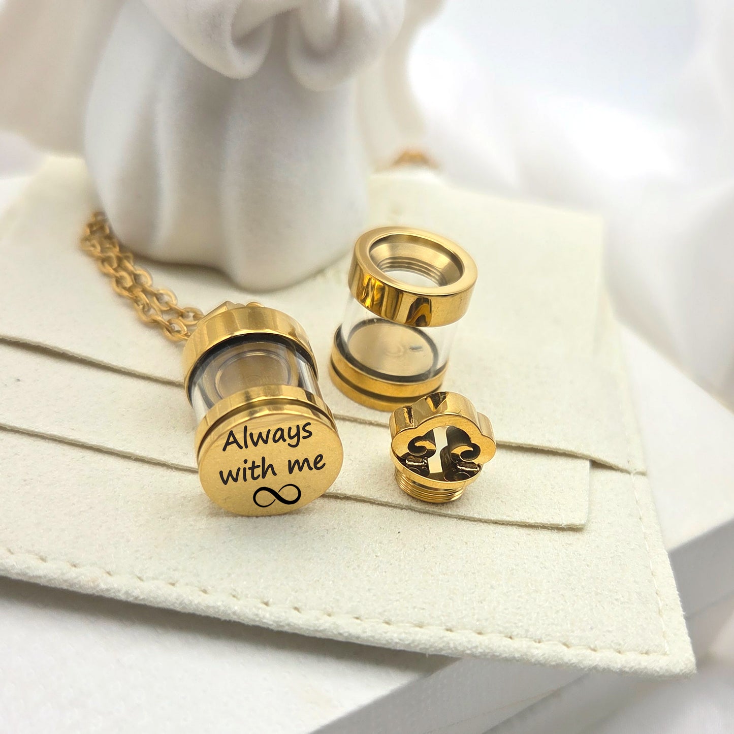 Personalized urn necklace for human ashes or hair.