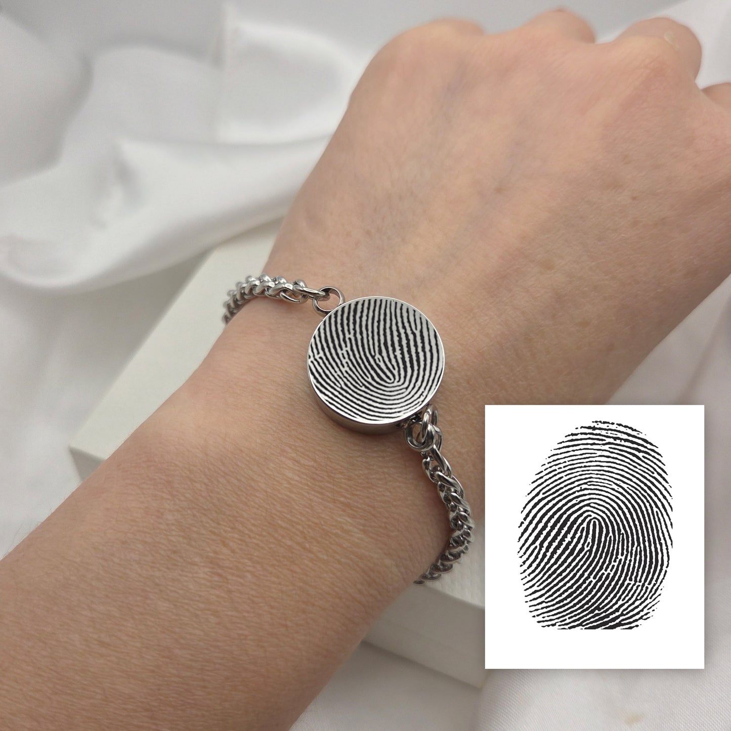 Thumbprint round urn bracelet for ashes.