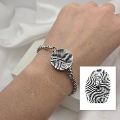 Thumbprint round urn bracelet for ashes.