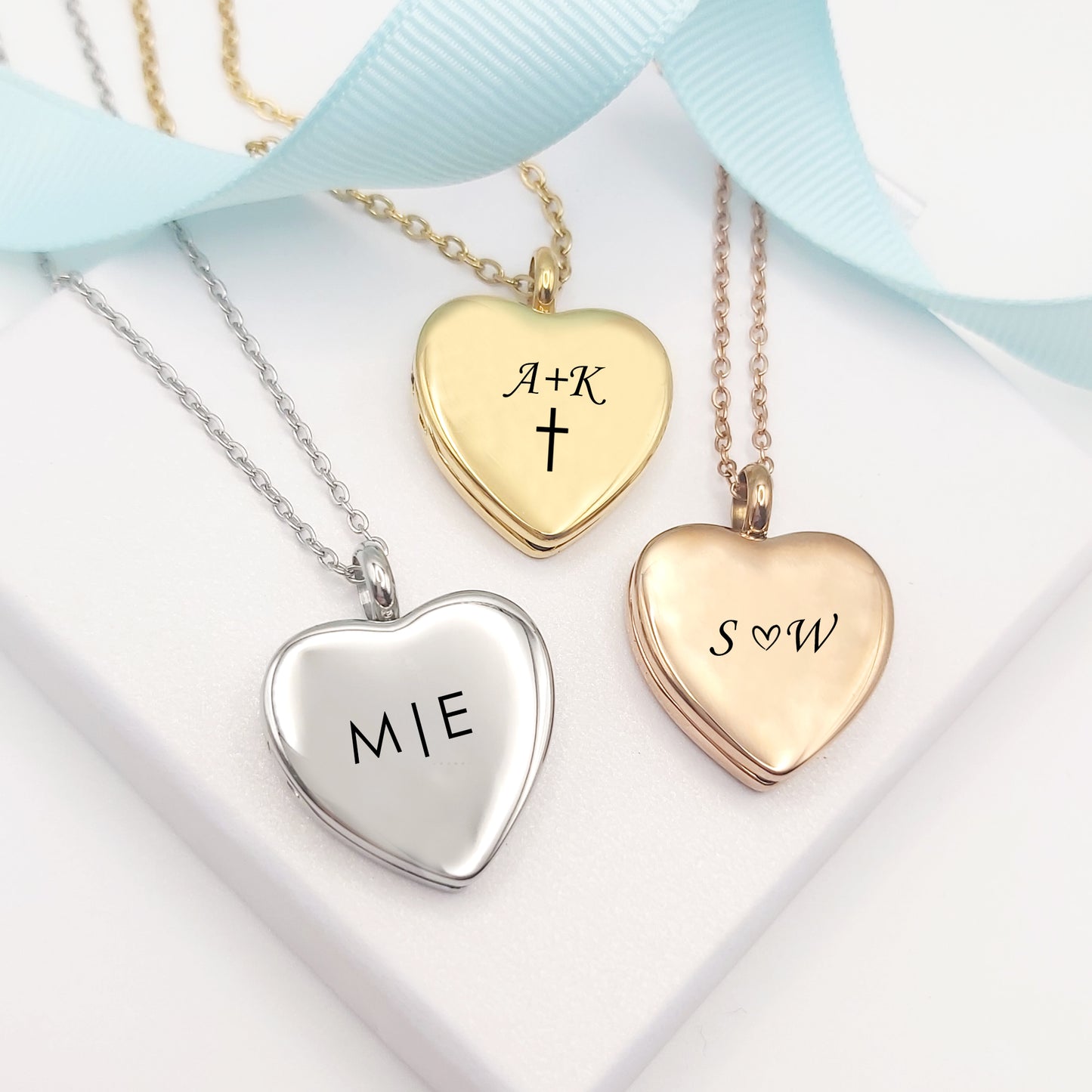 Anniversary locket with engraving and photos for her.