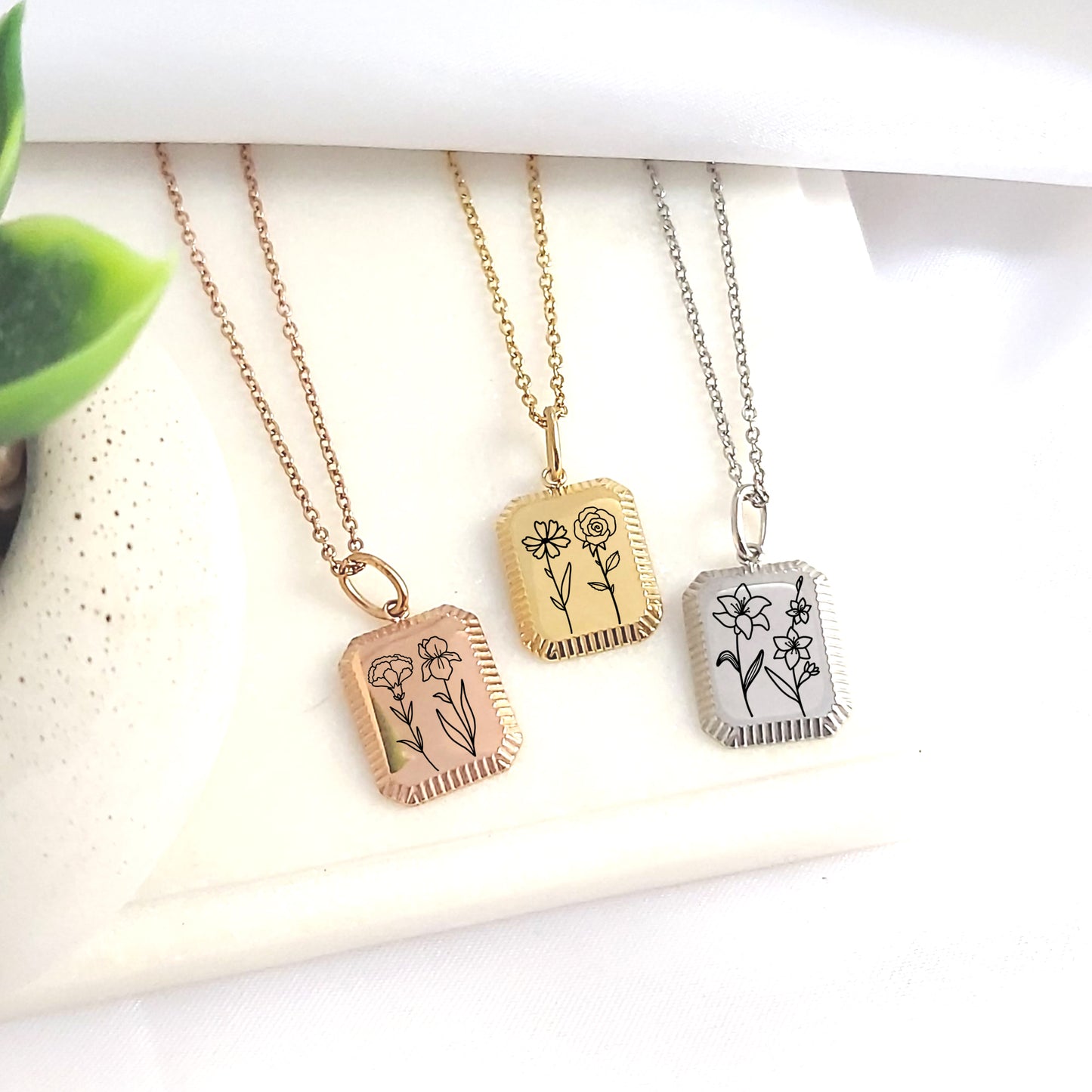 Personalized combined birth flower necklace.