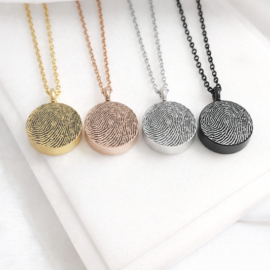Round urn necklace for ashes, custom engraved with fingerprint