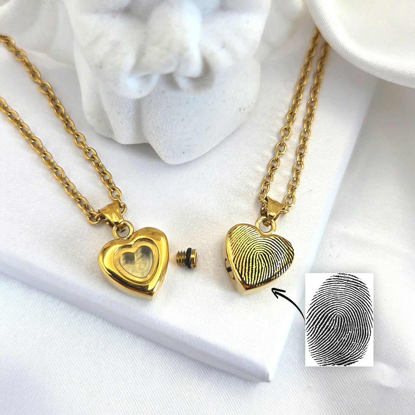 Custom thumbprint glass heart urn necklace for human ashes.