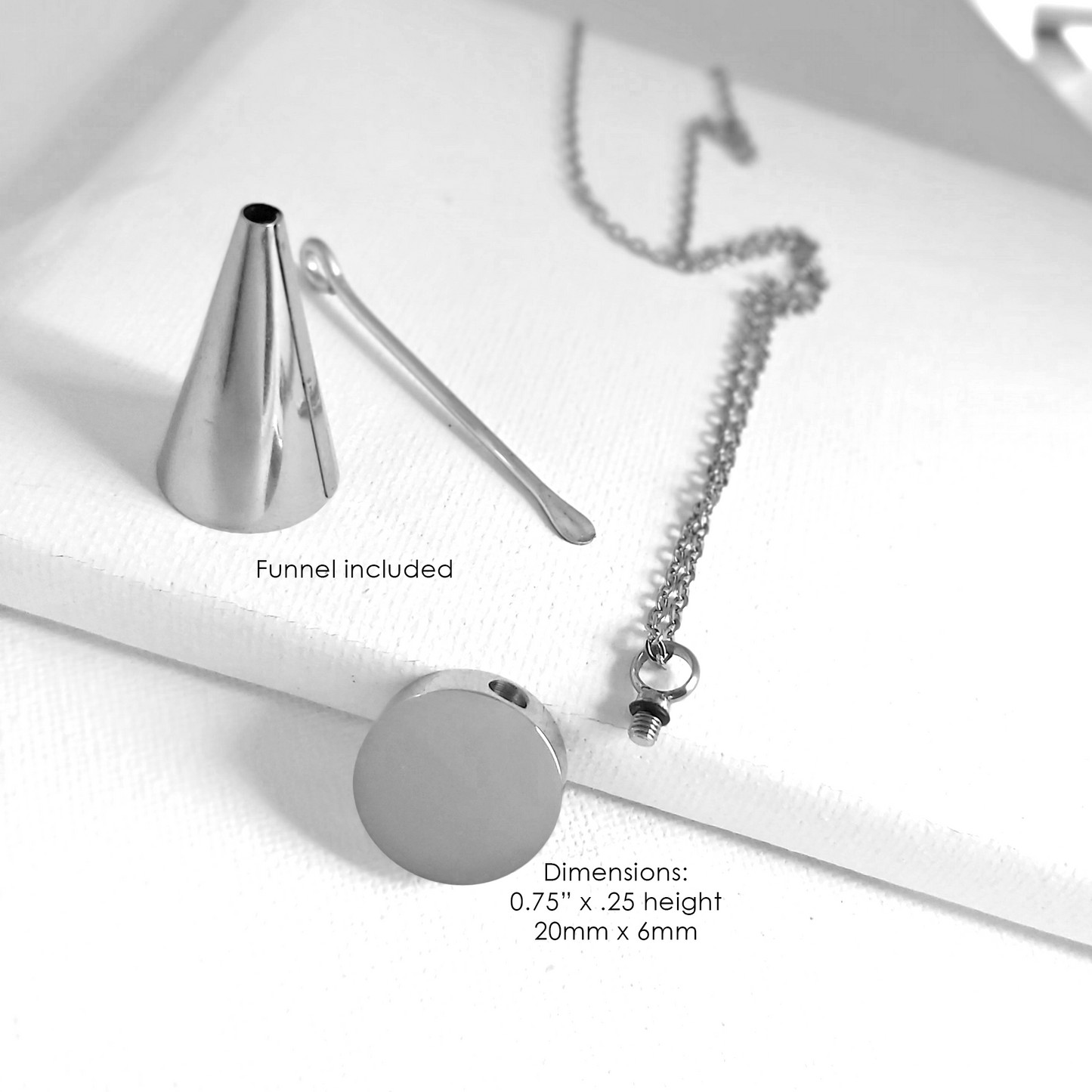 Engraved cremation round urn necklace for ashes.
