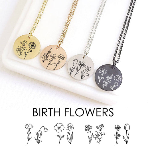 gold, rose gold, black and silver color necklaces with circular pendants featuring three birth flowers engraved on each one.