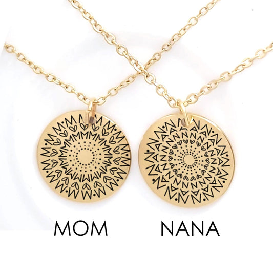 Two gold necklaces with mandala designs labeled 'Mom' and 'Nana' on a white background.