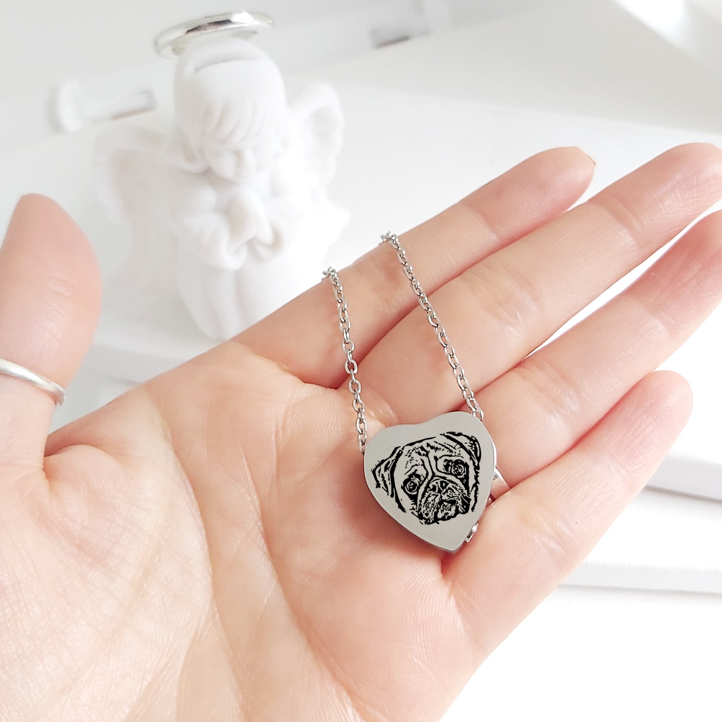 Pet portrait cremation heart urn necklace for ashes.