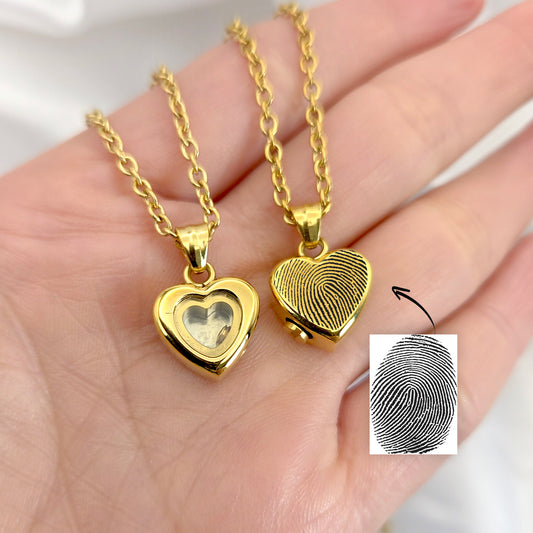 Custom thumbprint glass heart urn necklace for human ashes.