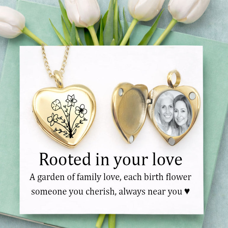 Gold heart locket necklace engraved with a custom birth flower bouquet, featuring multiple flowers symbolizing family love. Open locket reveals personalized photo inside. Displayed on a white card with mint green background and soft tulips. Personalized memorial jewelry, custom photo locket, birth flower necklace, gift for mom, grandma gift, Mother’s Day jewelry, sentimental keepsake, engraved gold locket, family necklace.