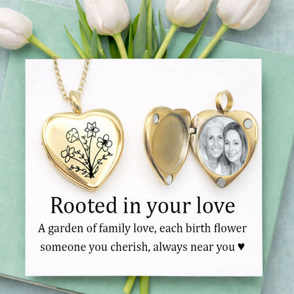 Gold heart locket necklace engraved with a custom birth flower bouquet, featuring multiple flowers symbolizing family love. Open locket reveals personalized photo inside. Displayed on a white card with mint green background and soft tulips. Personalized memorial jewelry, custom photo locket, birth flower necklace, gift for mom, grandma gift, Mother’s Day jewelry, sentimental keepsake, engraved gold locket, family necklace.