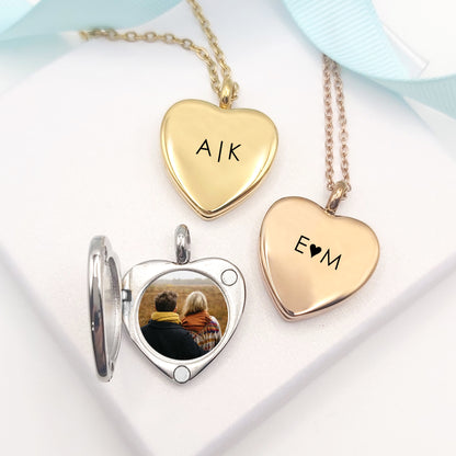 Anniversary locket with engraving and photos for her.