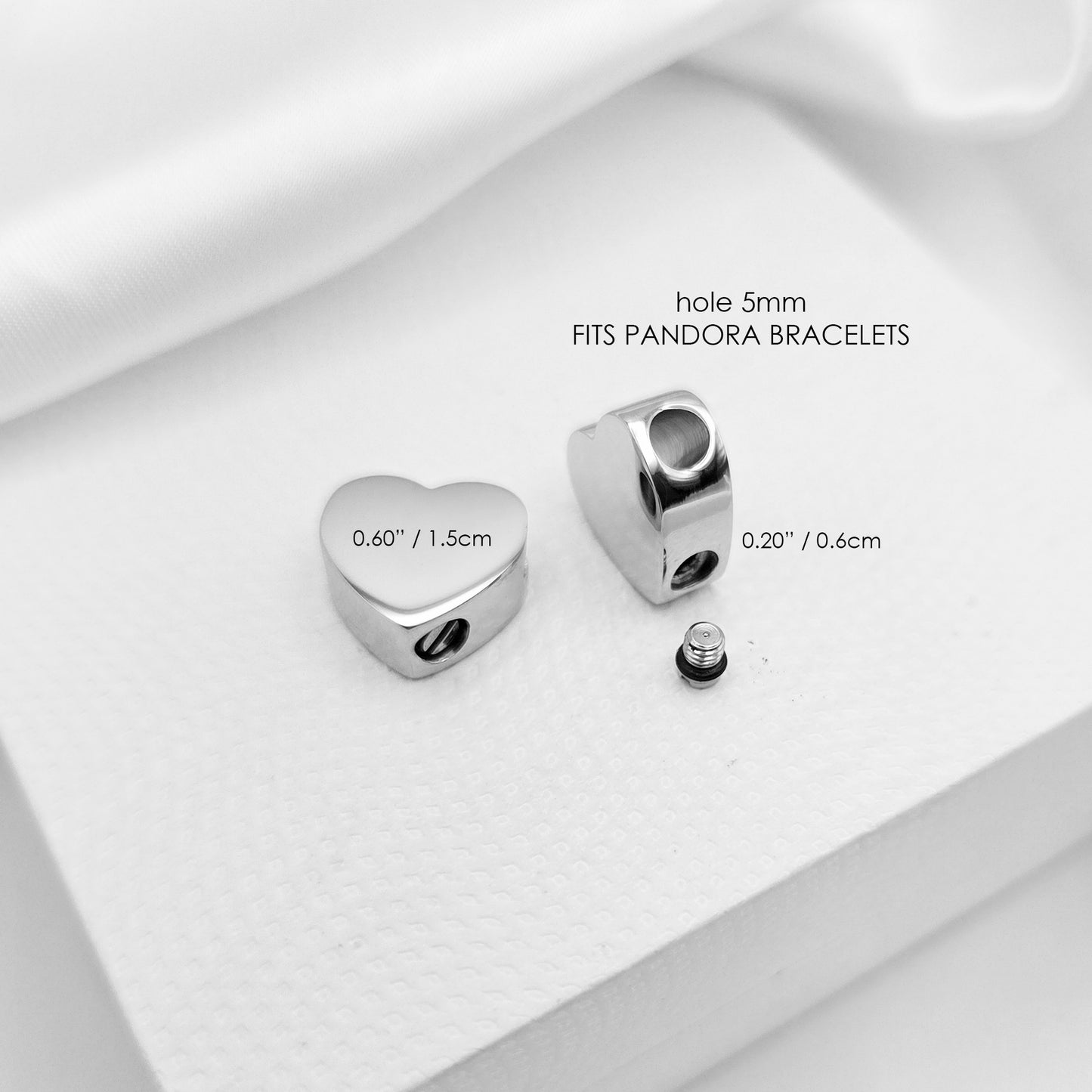 Your pet paw print heart urn charm for bracelet for ashes.