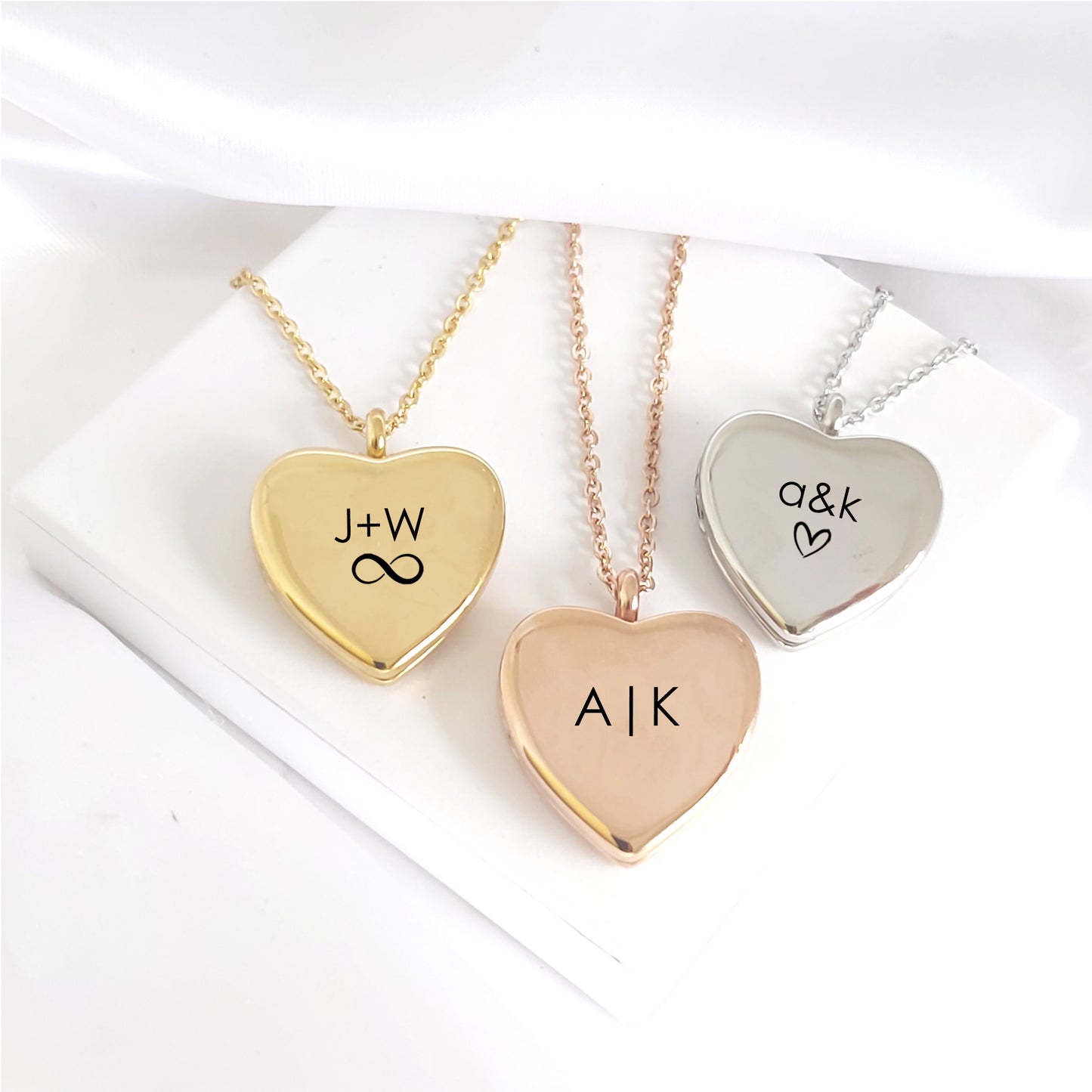 Anniversary locket with engraving and photos for her.