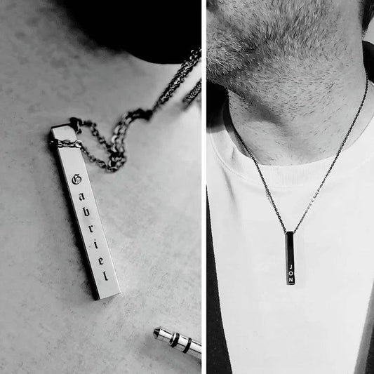 Silver necklace with a pendant engraved with 'Gabriel' on a plain background.