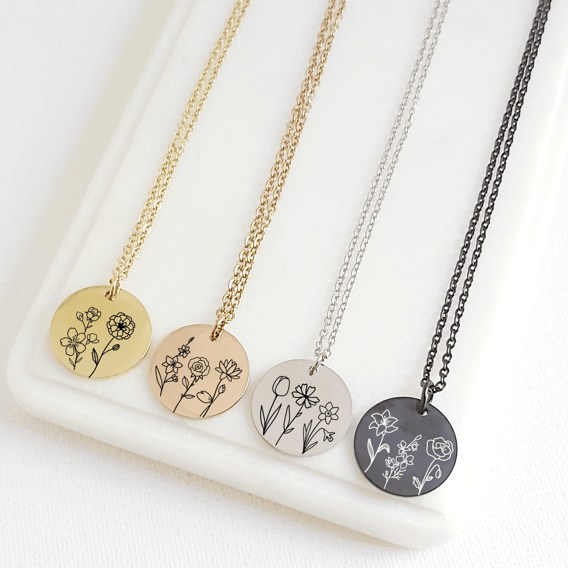 coin necklace engraved with up to three birth flowers