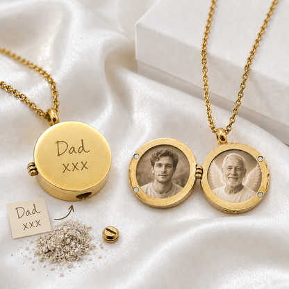 Two round gold-tone memorial urn lockets with matching chains on white fabric. One closed locket is engraved with the handwritten words “Dad xxx.” The other is open and displays two circular photos of men, including an older man with angel wings. A handwriting sample, small screw and symbolic ashes appear below.