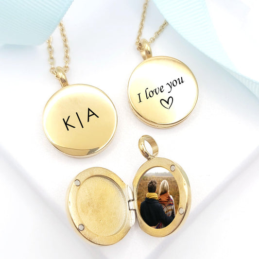 Gold necklaces with engraved messages on a white background