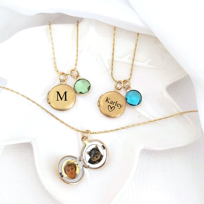 Tiny locket with engraving and photos.