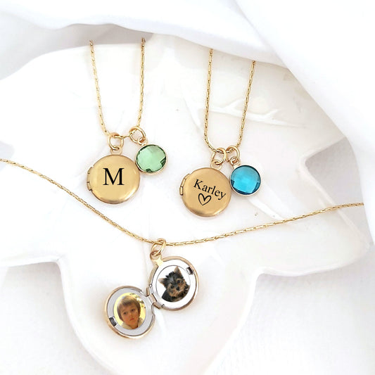 Tiny locket with engraving and photos.