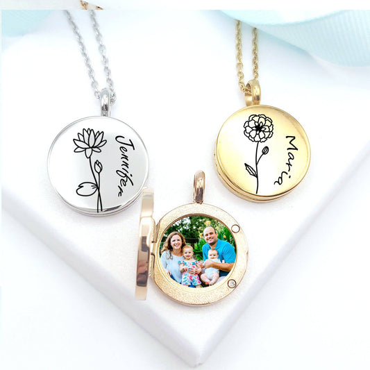 Three necklaces with engraved names and a family photo on a white background
