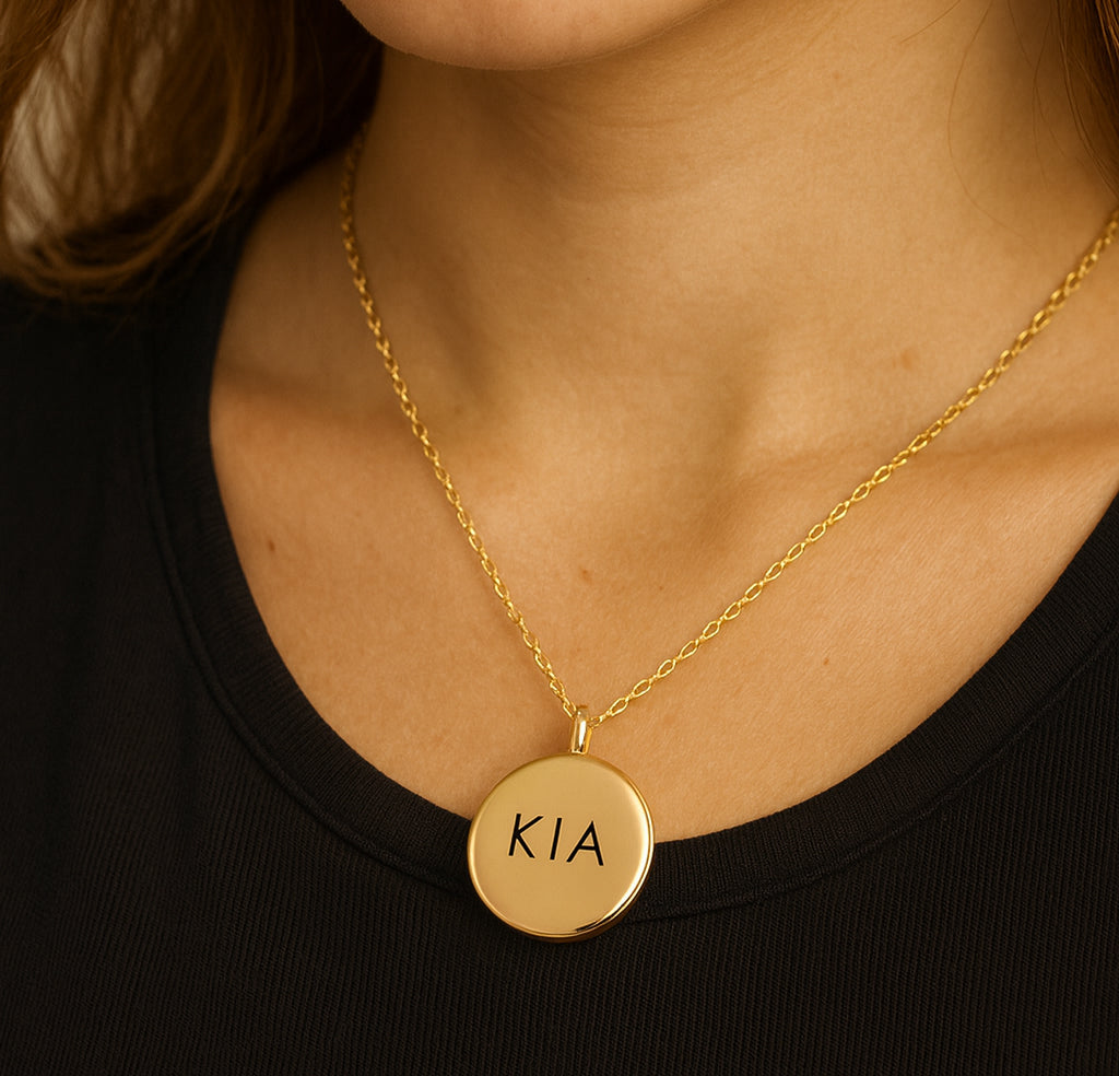Locket engraved with initials and photos for her and him.