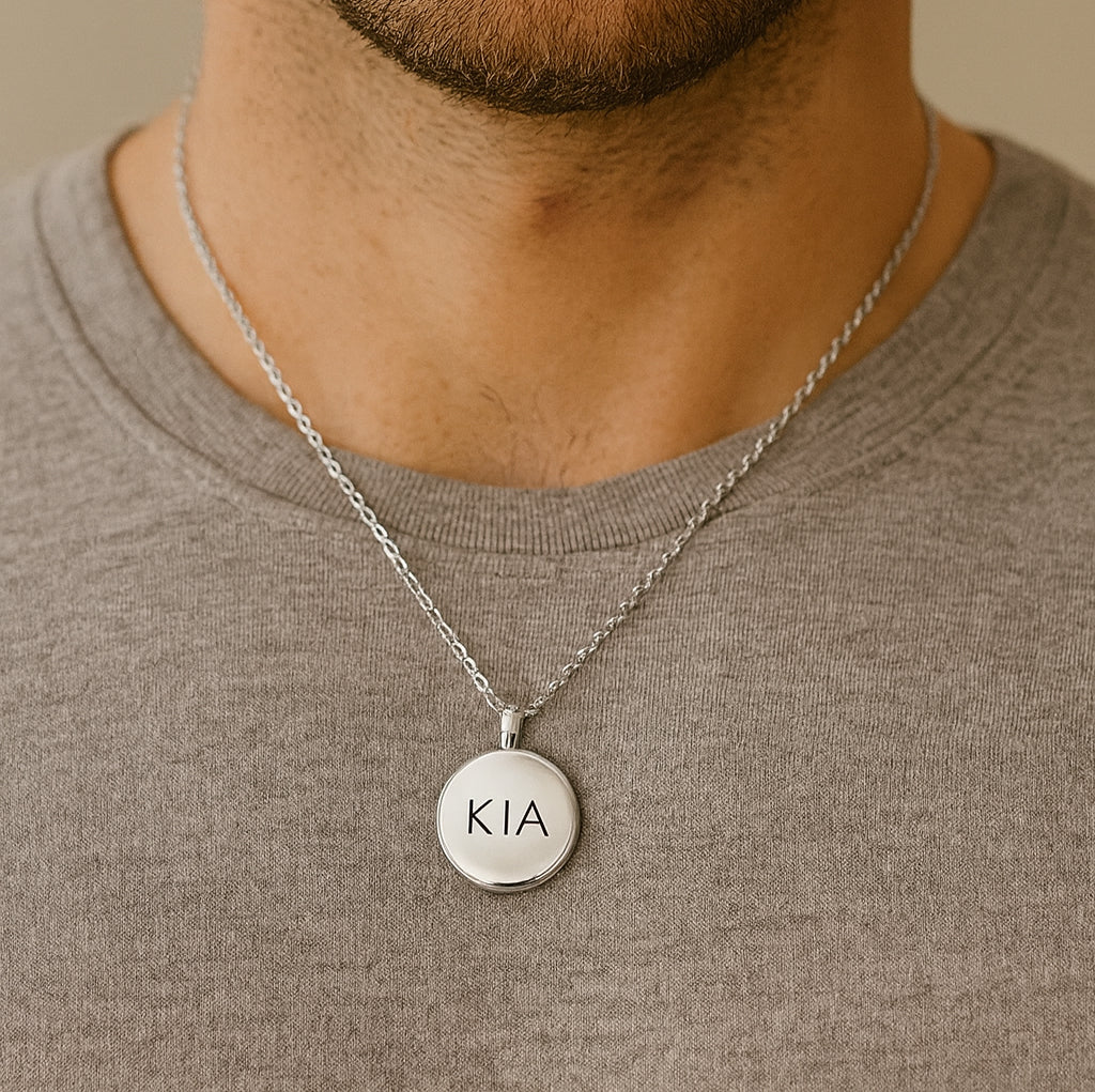 Locket engraved with initials and photos for her and him.