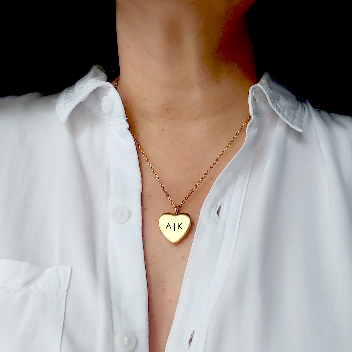 Anniversary locket with engraving and photos for her.