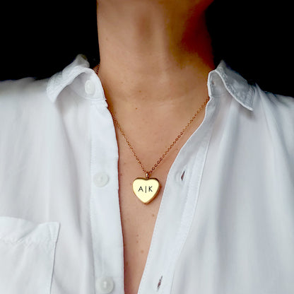 Anniversary locket with engraving and photos for her.