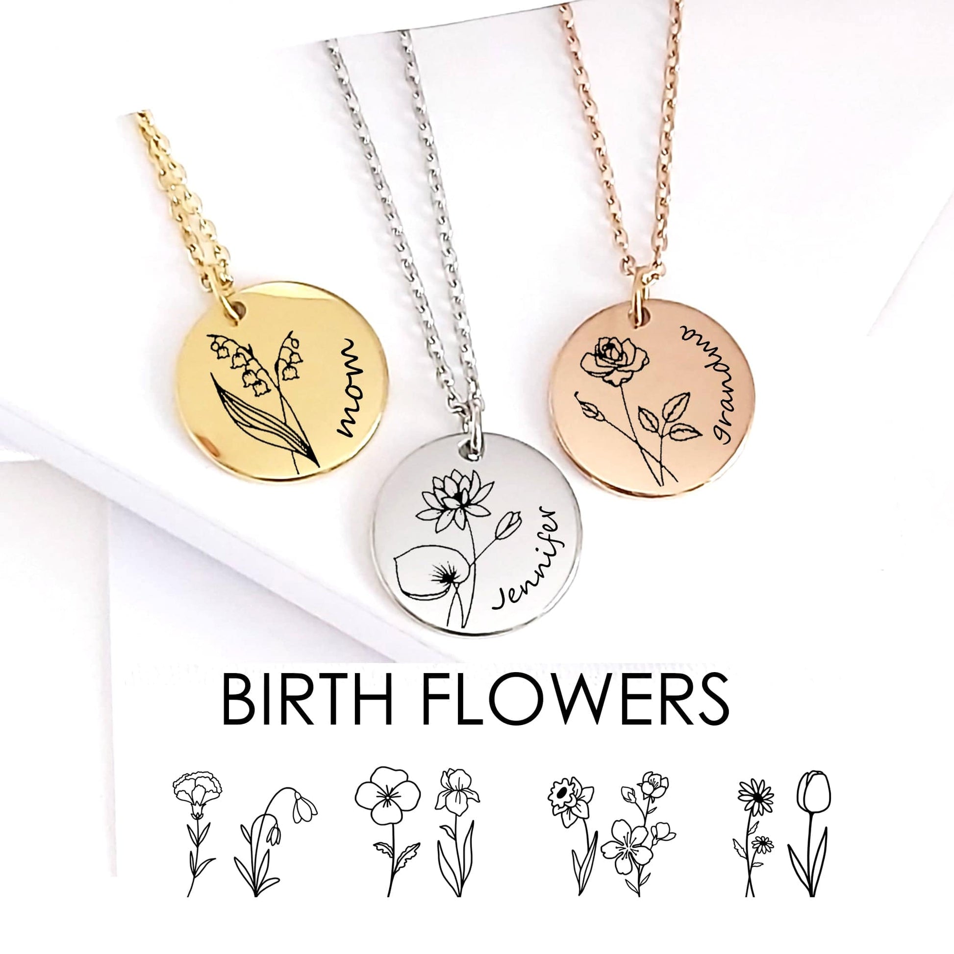 Three necklaces with circular pendants featuring floral designs and names on a white background.