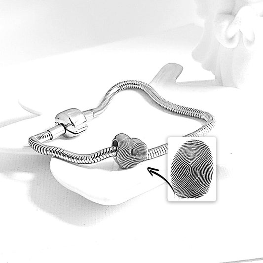 Engraved thumbprint heart charm for bracelet.