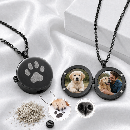Personalized round silver-tone pet memorial urn locket shown open with two circular photos inside and a custom pet nose print and name engraved on the polished front.