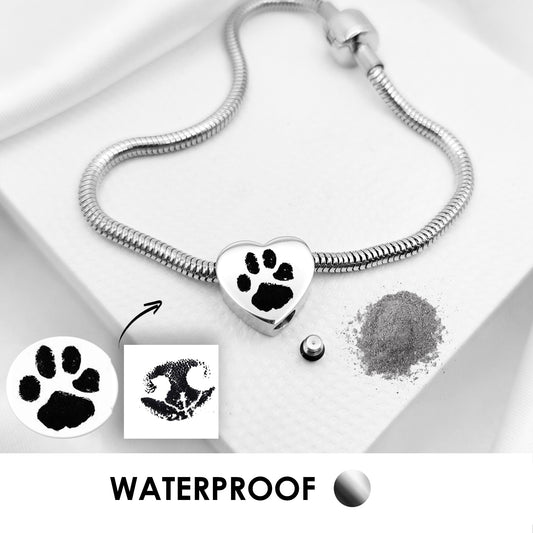 Your pet paw print heart urn charm for bracelet for ashes.