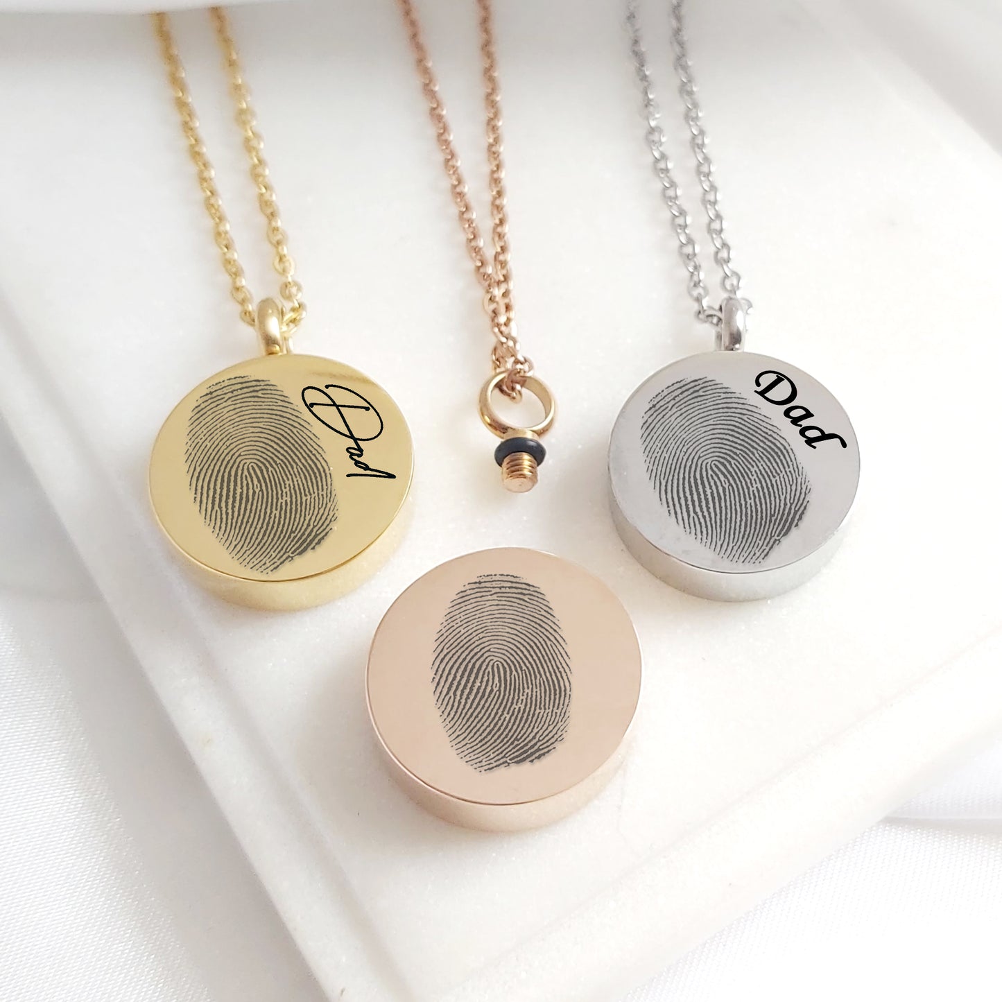 Custom thumbprint urn necklace for human ashes.