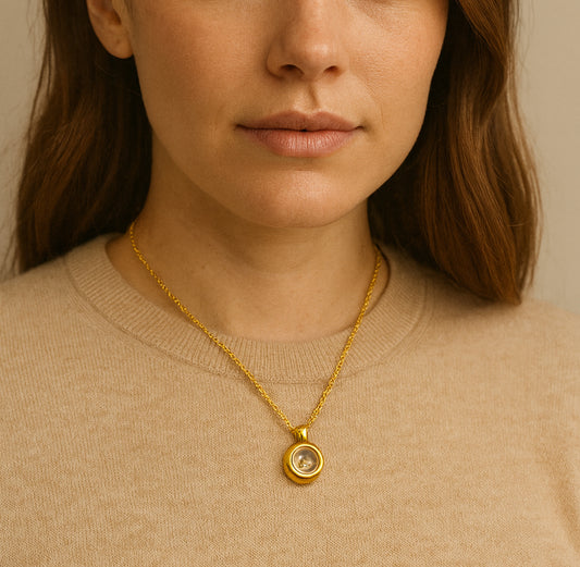 Unisex memorial thumbprint urn necklace for human ashes.