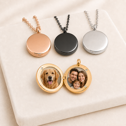 Three round stainless steel photo lockets displayed on a soft ivory background: closed rose gold and silver lockets with matching chains, plus an open gold locket holding two circular baby photos. Each locket has a smooth, blank finish ready for custom engraving and personalization.