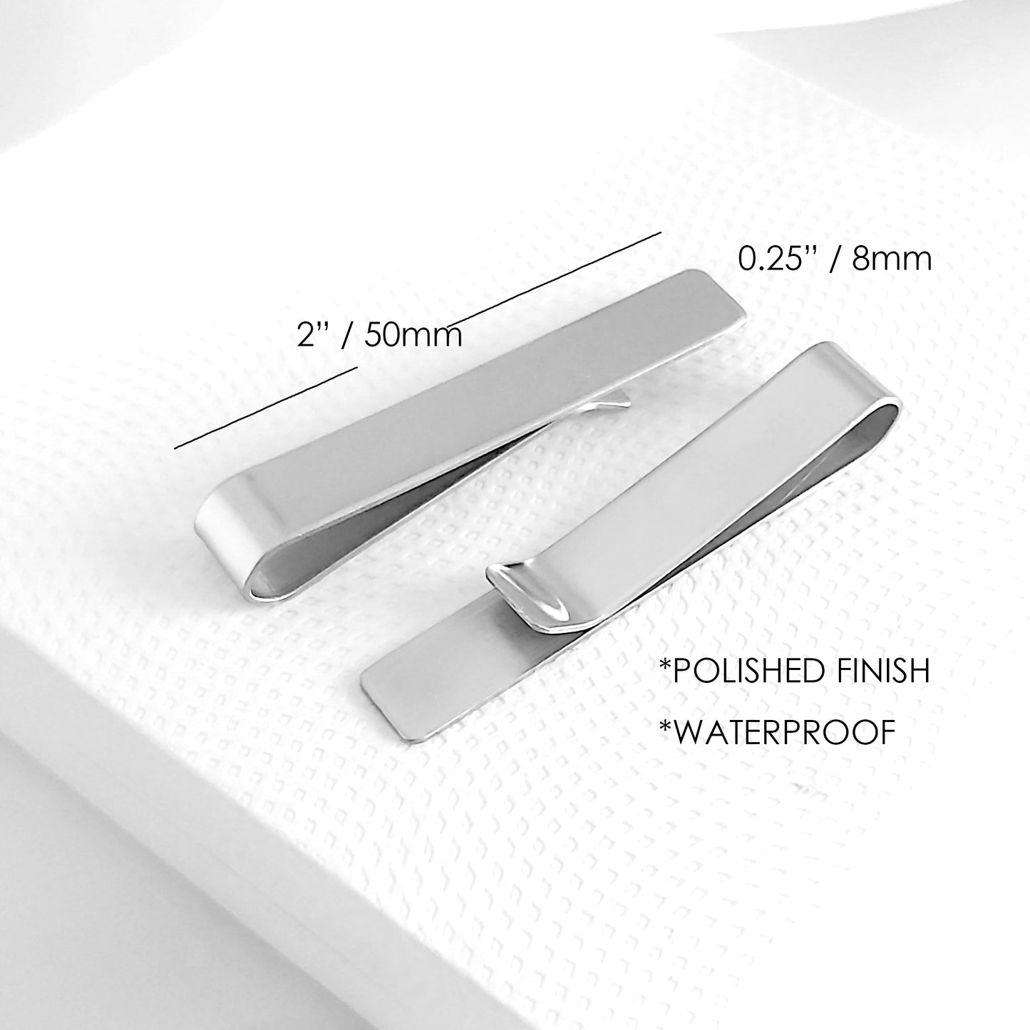 Personalized stainless steel tie clip, laser engraved with a name, date or message.