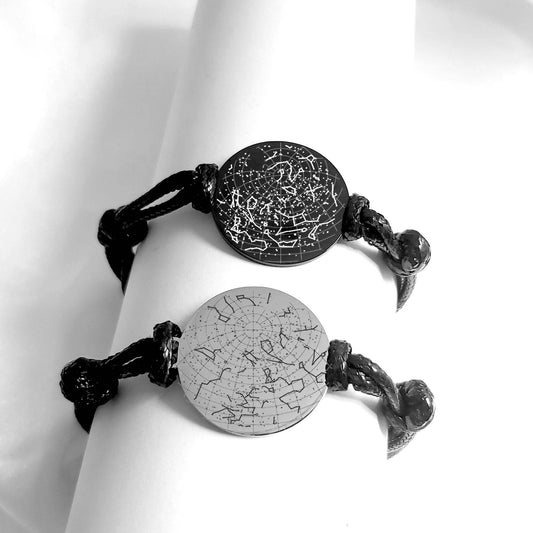 Black and silver bracelet engraved with star maps