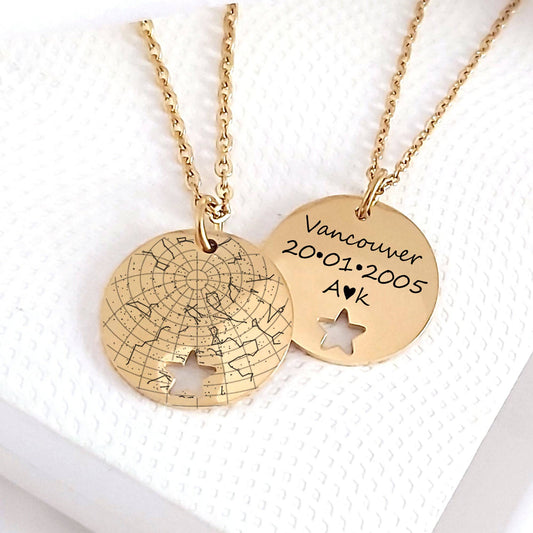 coin necklace with a  cut out star at the bottom engraved on the front with a star map and a message on the back