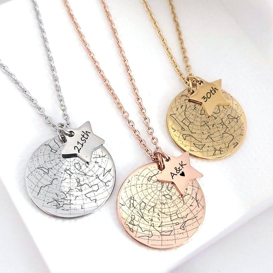 Three necklaces with star-shaped pendants and engraved text on a white background