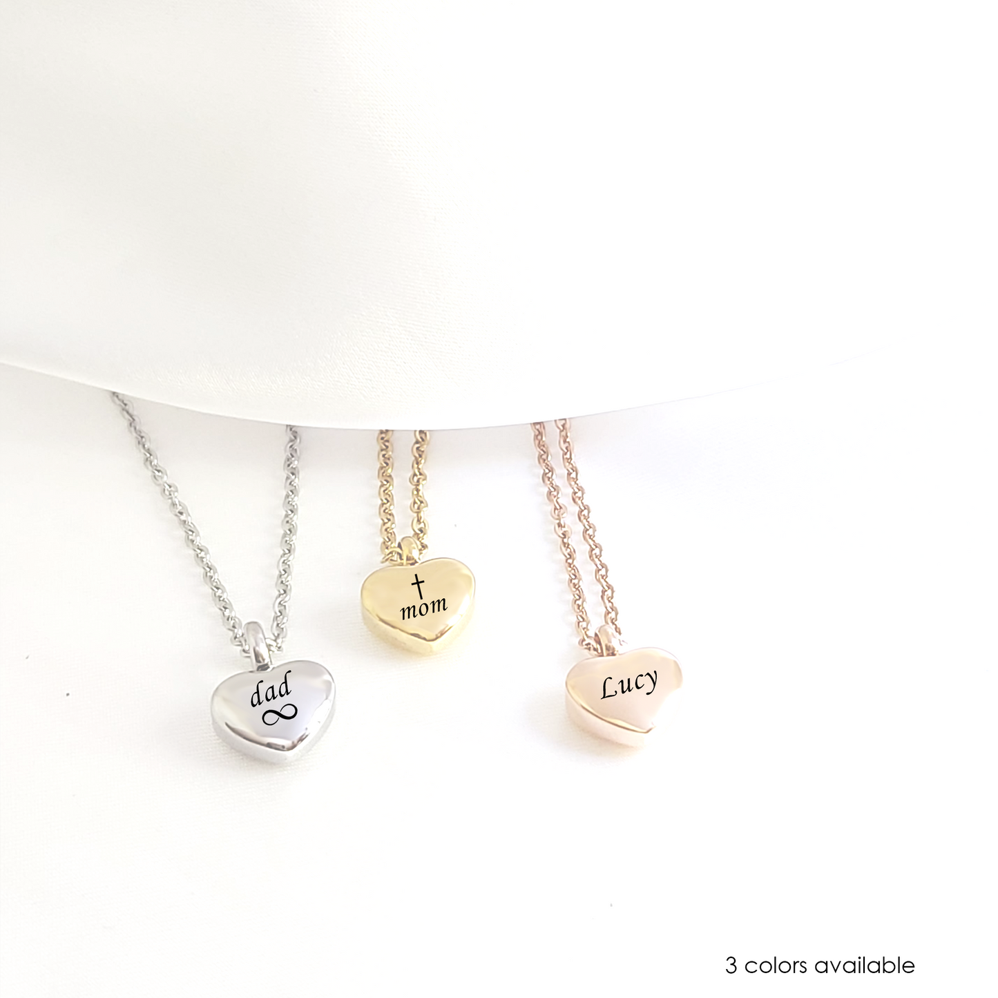 Engraved cremation heart urn necklace for ashes.